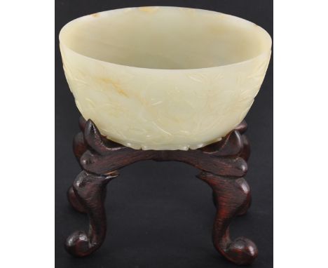 A late 19th/ early 20th Century Chinese oval celadon jade bowl decorated with pomegranates, flowers and trailing branches, th