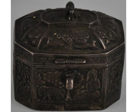 A 19th Century Indian octagonal silver tea caddy with elephant finial embossed with figures and animals in wooded landscapes,
