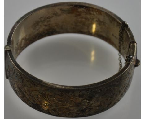 An early 20th Century engraved silver hinged bangle