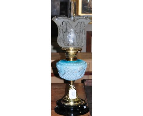 A late Victorian brass oil lamp, with etched glass shade and turquoise moulded glass reservoir. H. 60cm