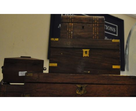 Two late Victorian brass mounted walnut writing slopes together with a sarcophagus tea caddy and two other Victorian boxes