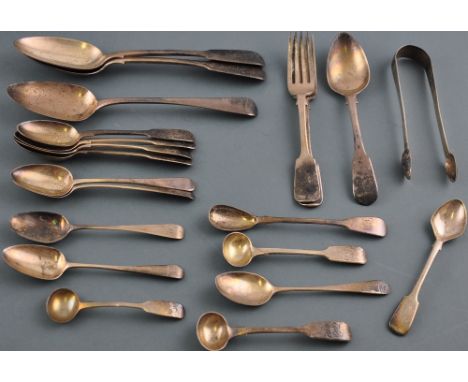 A collection of Georgian and Victorian silver flatware to include fiddle pattern serving spoons, mustard and condiment spoons