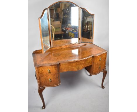 A Mid 20th Century Mahogany Cross Banded Burr Walnut Serpentine Front Dressing Table with Centre Drawer Flanked by Two Small 