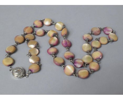 A Japanese Silver Mounted and Dyed Mother of Pearl Necklace, the Clasp Decorated with a Dragon, 52cm 