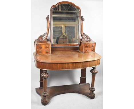 A Late Victorian Mahogany Duchess Style Bow Fronted Dressing Table with Raised Jewel Drawers and Swing Mirror, 105cm wide 