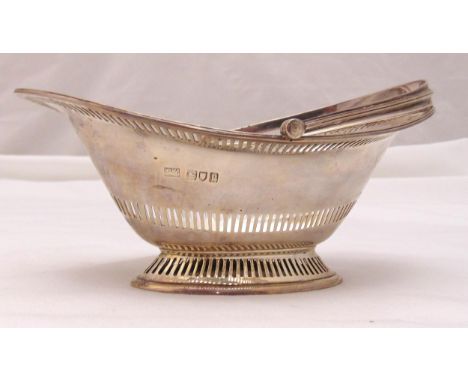 A Mappin and Webb hallmarked silver shaped bonbon dish oval with bar pierced sides and reeded swing handle, London 1910, appr