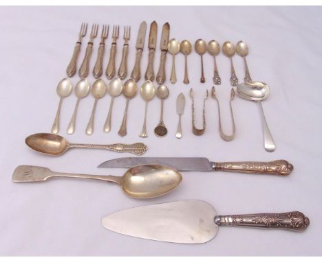 A quantity of hallmarked silver flatware to include dessert eaters, a sauce ladle, teaspoons, tongs, a cake slice and a table