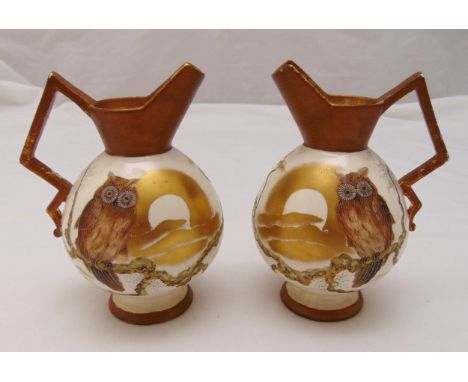 A pair of Victorian ceramic ewers decorated with owls and trees, marks to the bases, 18.5cm (h)