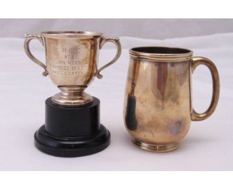 A Victorian hallmarked silver christening mug with D-form handle on circular foot, Sheffield 1883 and a miniature hallmarked 