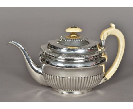 A George III silver teapot, hallmarked London 1806, maker's mark of John EmesOf stopped gadrooned form, with ivory finial and