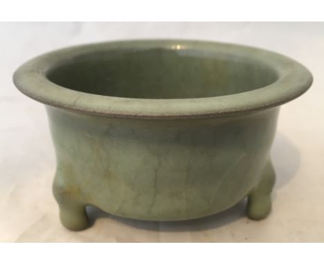 A Chinese Ming/Juan period celadon glazed porcelain brush washerWith flared rim and tripod feet, old paper label to underside
