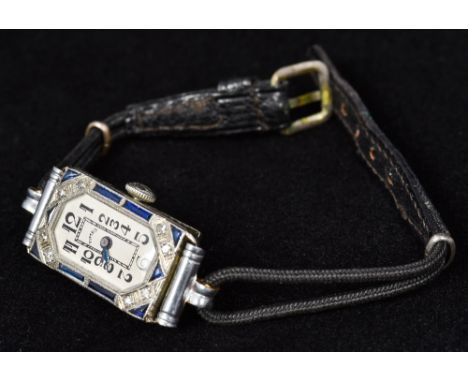 An Art Deco 18 ct white gold diamond and sapphire set ladies cocktail watchThe case stamped S Bruner 18ct, the fifteen jewel 