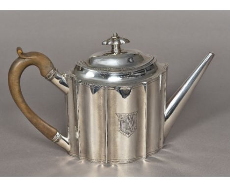 A George III silver teapot, hallmarked London 1796, maker's mark of Peter and Anne BatemanOf serpentine lozenge form, the hin