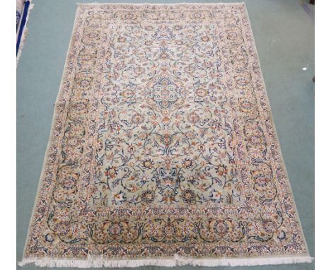 A LIGHT GREEN GROUND KESHAN RUG, with allover floral design, 317cm x 220cm Condition Report: Some wear as minor damage to edg