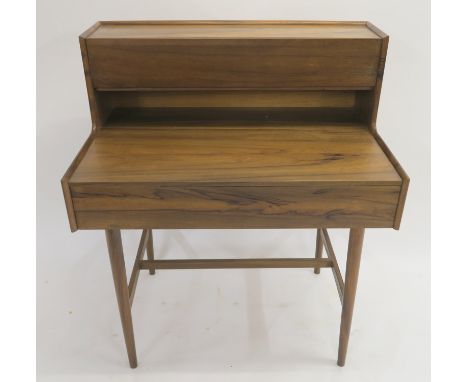 A RICHARD HORNBY MID CENTURY TEAK WRITING DESK, the upright upper section with a fall front panel opening to reveal a fitted 