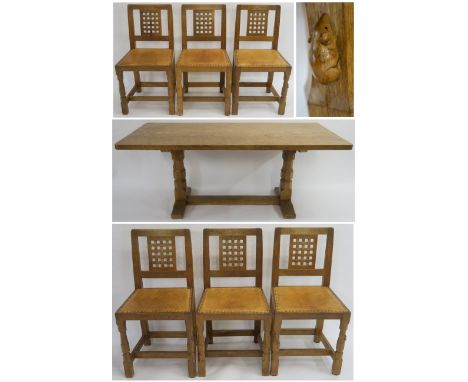 A ROBERT "MOUSEMAN" THOMPSON OF KILBURN DINING TABLE AND CHAIRS, the dining table having adzed top on octagonal supports conn