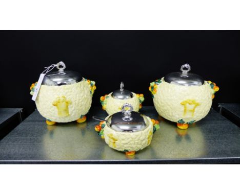 A collection of four Clarice Cliff Celtic Harvest globular moulded pots with chrome lids, tallest 14cm high
