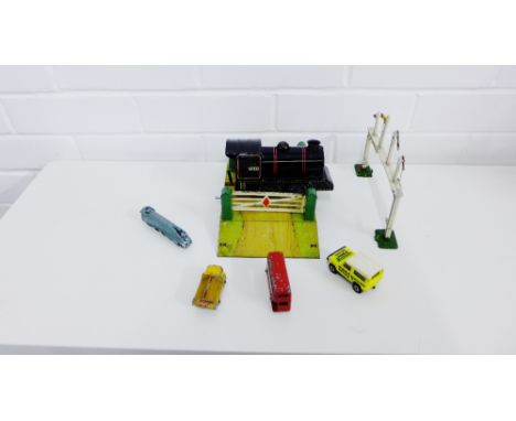 A mixed lot to include Hornby tin plate station accessories, track and a 6700 engine, together with miscellaneous coaches to 