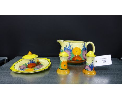 A collection of Clarice Cliff Gay Day pattern pottery to include a three piece condiment set, jug and a side plate (5)