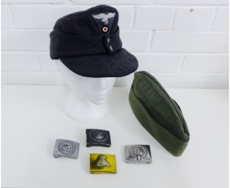 Mixed lot to include two German Army cloth caps, three Replica belt buckles and a brass NSBO belt buckle (6) 