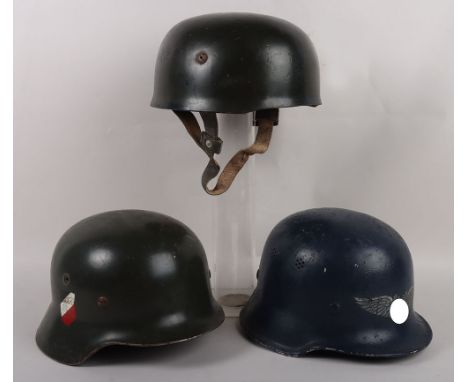WW2 Style German Helmets: Three reenactment helmets to include German parachutist helmet with liner and chinstrap, Luftschutz