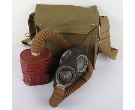 WW2 British Army Gas Mask: A super condition gas mask with tube and filter in bag stamped by maker and dated 1942.  