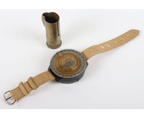 WW2 German Luftwaffe wrist Compass : Smaller type with tropical strap ,makers sbe to back and a brass lighter outer case. 2 i