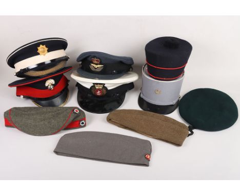 Military Headdress: A  mixed selection  to include  RAF officers, Merchant Navy officers, two guard peak hats, a good reprodu