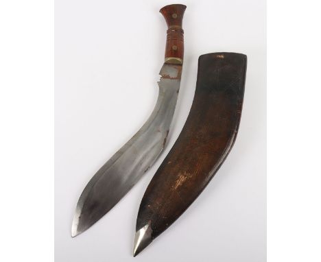 Vintage Kukri : Wood and brass hilt with 30 cm blade housed in leather sheath, overall 42 cms