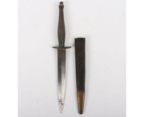 Fairbairn Sykes (F.S) Commando Knife:  Double edge blade with FS and WILKINSON etchings and black brass hilt and cross guard,