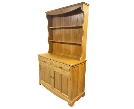 Unicornman - light oak dresser, the shaped cresting rail carved with Yorkshire rose over two heights plate rack, the panelled