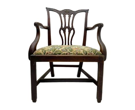 George III mahogany elbow chair, the shaped cresting rail carved with extending foliate motif over Gothic Chippendale design 