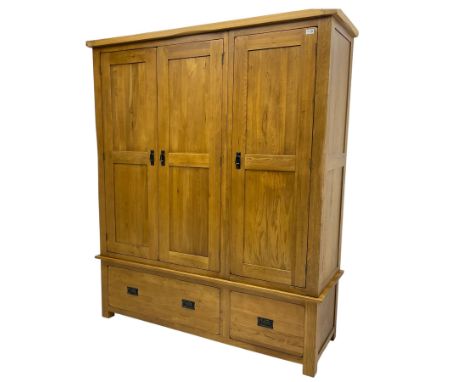 Light oak triple wardrobe, enclosed by three panelled doors, fitted with two drawersDimensions: Height:&nbsp;193cm&nbsp; Leng