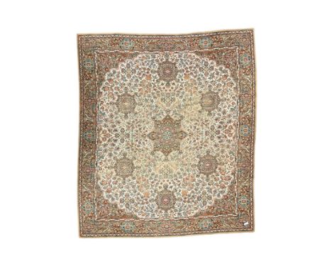 Large Persian design carpet, overall floral design, the field decorated with large rosette motifs surrounded by trailing foli