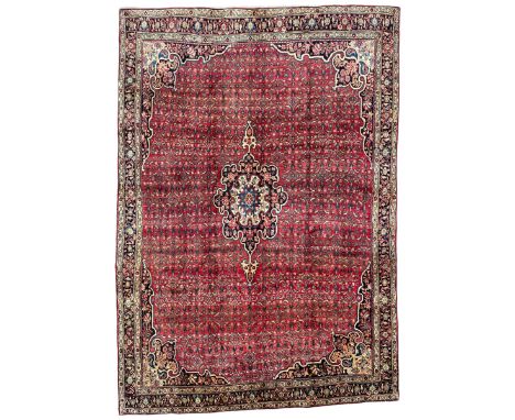 North West Persian Bidjar red ground carpet, the central foliate pole medallion in a field with matching spandrels and all-ov