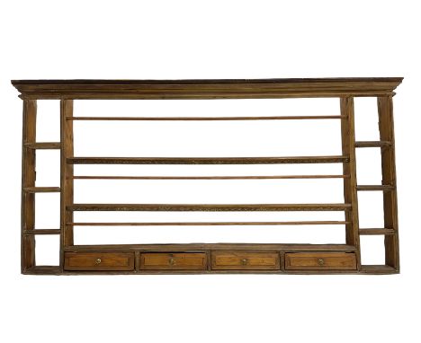 18th century pine wall hanging plate rack, projecting cornice over three tiers and four spice drawers, flanked by four tier s