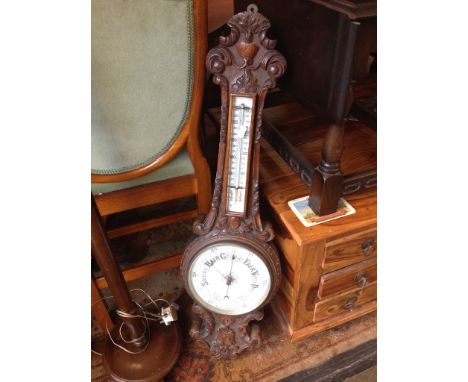 CARVED OAK ANEROID BAROMETER. H87CM