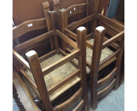 A SET OF 4 RUSH SEAT LADDER BACK CHAIRS