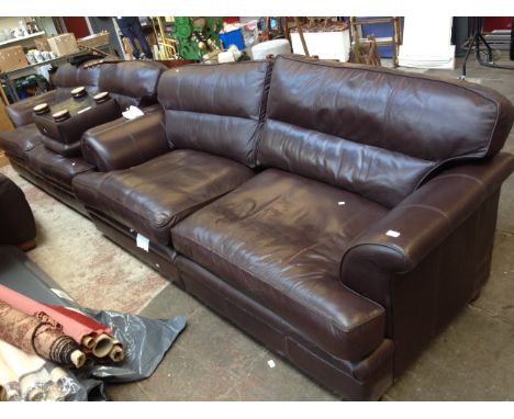 A 2 PIECE BROWN LEATHER SUITE WITH POUFFE