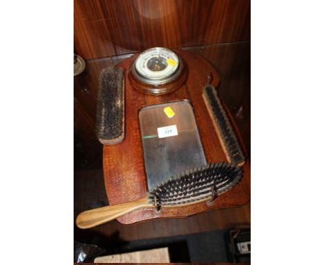 A VINTAGE OAK WALL MOUNTED VALET WITH INSET BAROMETER AND MIRROR