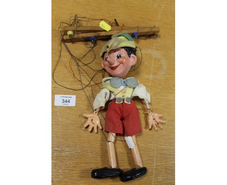 A VINTAGE WOODEN PINOCCHIO PUPPET