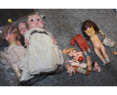 THREE SMALL VINTAGE DOLLS, A BAG OF VINTAGE MINIATURE TOY DOLLS AND A VINTAGE ROLLER EYE DOLL MARKED PEDIGREE, TOGETHER WITH 