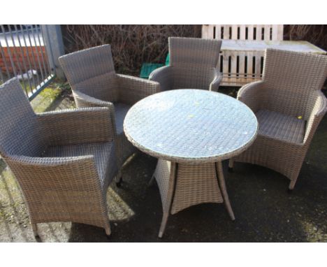 A HARTMAN SET OF FOUR CHAIRS AND GLASS TOPPED TABLE