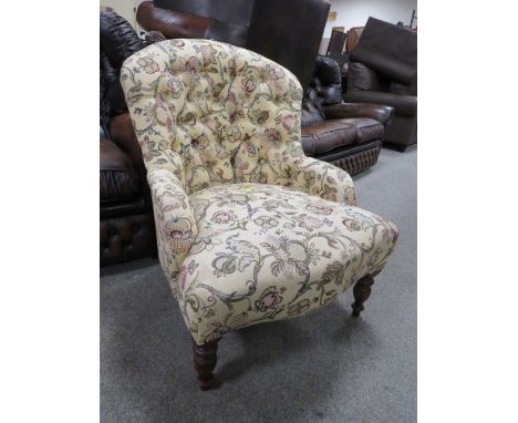 A MODERN UPHOLSTERED BUTTON BACK CHAIR