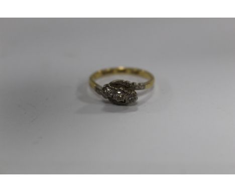 AN 18 CARAT GOLD ILLUSION SET THREE STONE DIAMOND RING, RING SIZE M