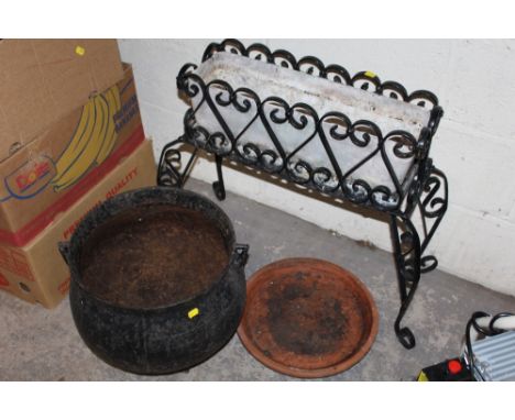 A METAL PLANTER STAND TOGETHER WITH A CAULDRON