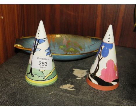 TWO UNMARKED CLARICE CLIFF STYLE SUGAR CASTORS TOGETHER WITH A CARLTON WARE BLEU ROYALE DISH (3)