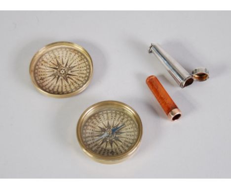 A silver cheroot holder case containing a 9ct rose gold moulded amber CHEROOT HOLDER, also an Antique turned brass cased pock