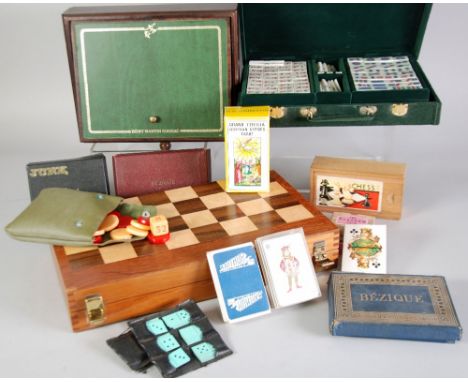 A cased Mah-Jong set, a cased Backgammon board game, sets of playing cards etc