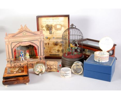 A modern cased swinging bind automaton, a modern Swise Reuge Cylinder musical box, and eight various automaton and other musi